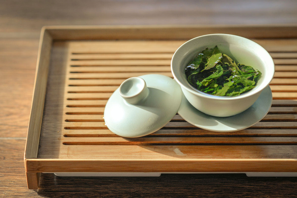 image of gren tea in a tea cup on a wooden table