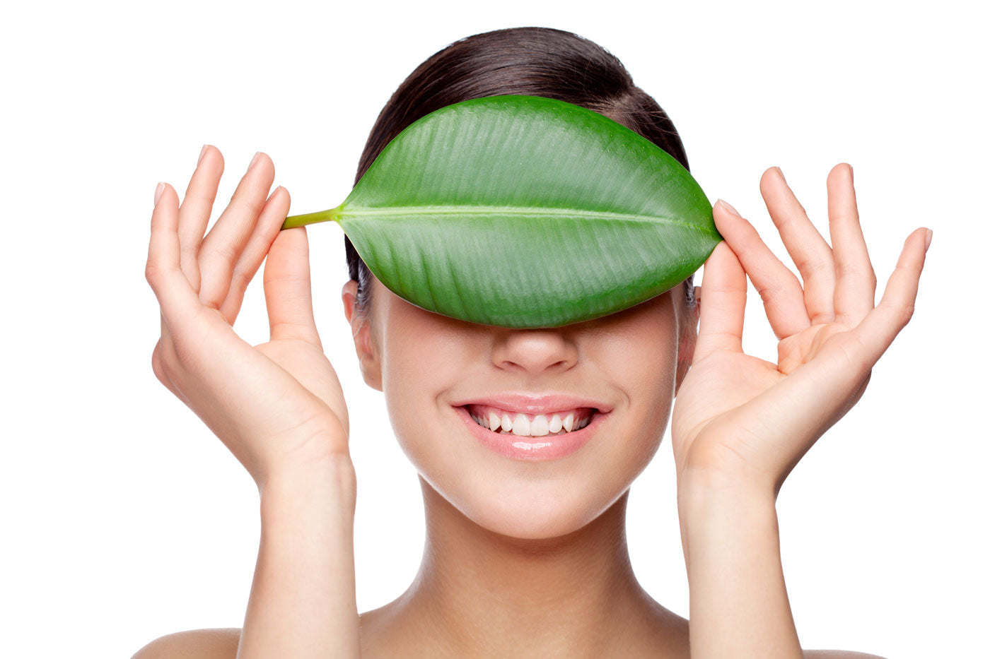 image of woman with large leaf on face