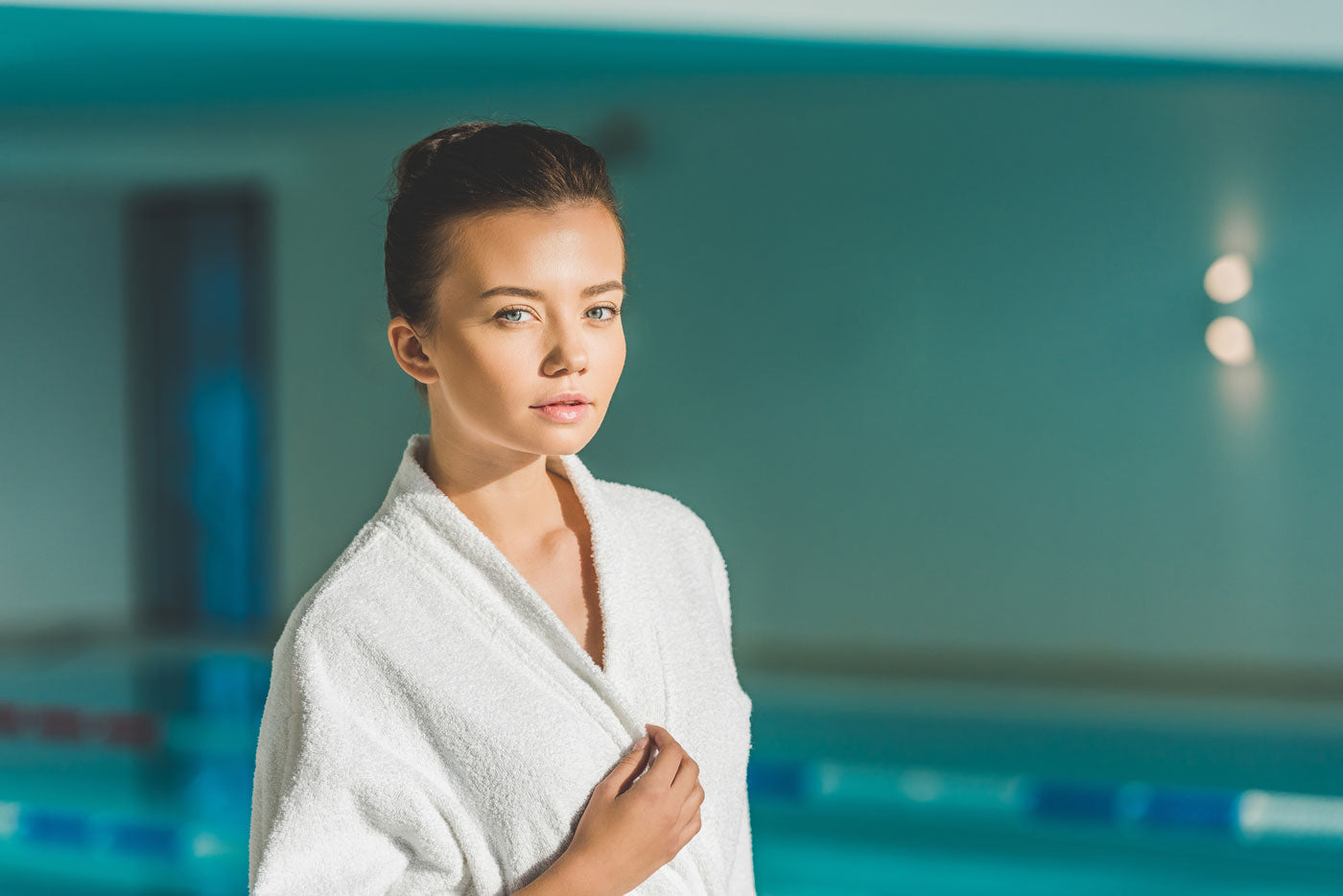 image of woman in bathrobe at the pool