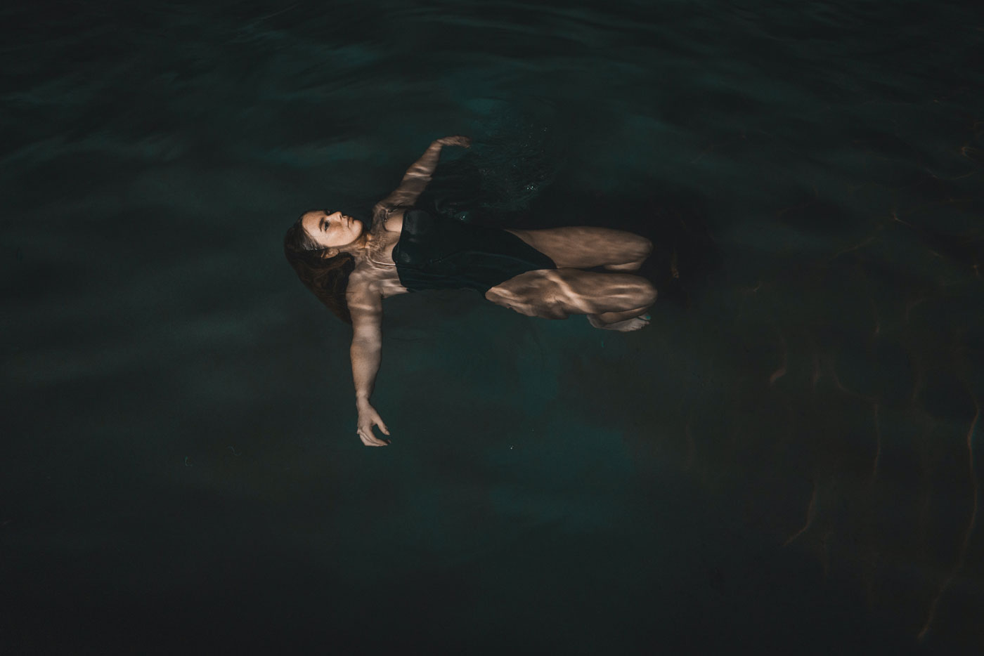 image woman floating in water